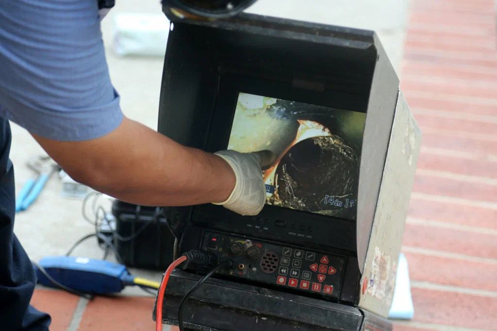 Technician viewing a drain inspection camera in Springfield